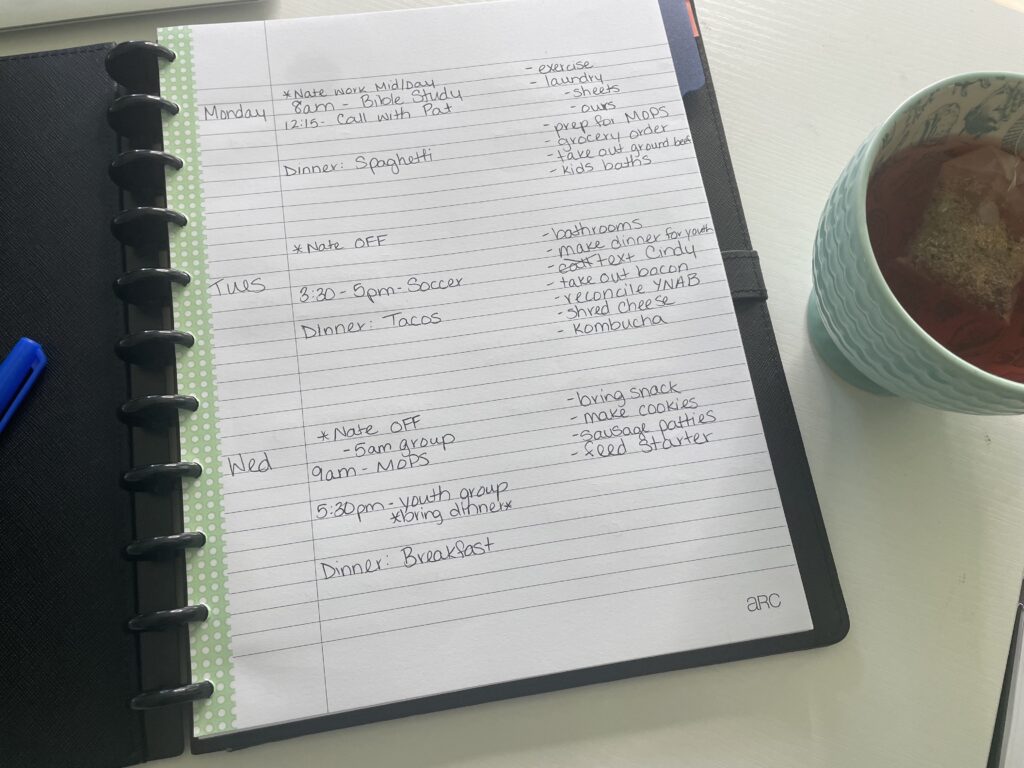 notebook on desk with teacup